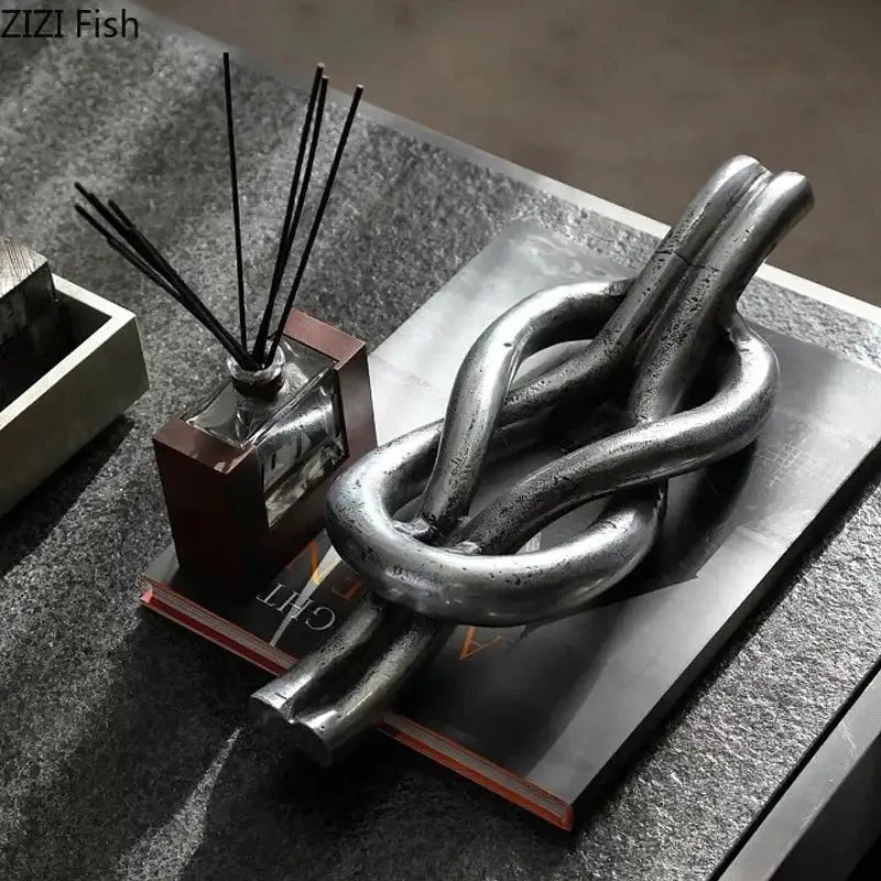 Rustic dark metal geometric knot resin sculpture living room artwork