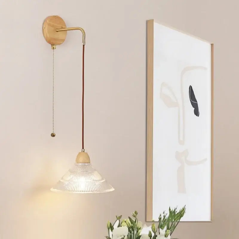 Rustic wood and brass wall light with clear glass pull chain switch