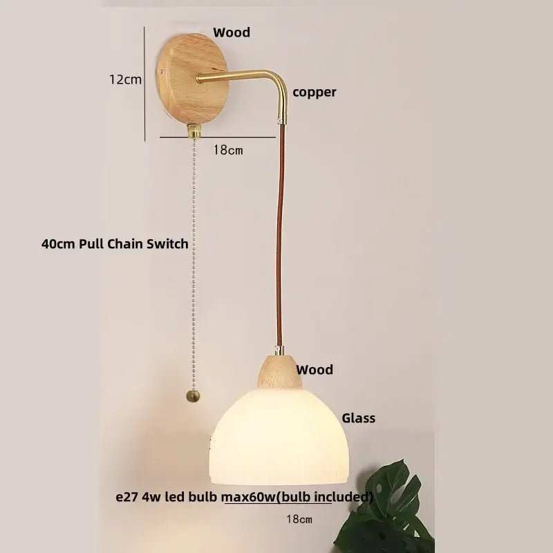Rustic wood and brass wall light with clear glass pull chain switch