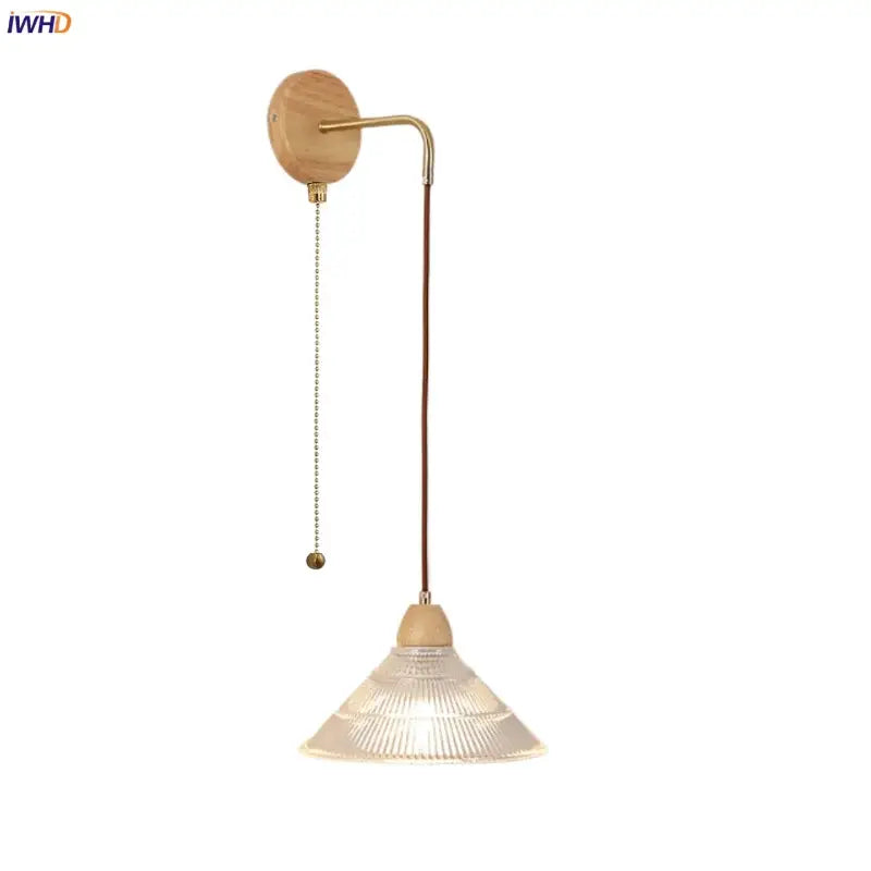 Rustic wood and brass wall light with clear glass pull chain switch
