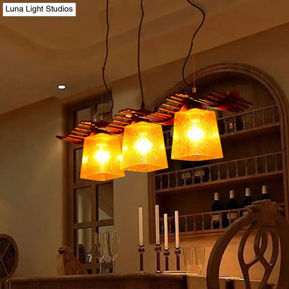 Rustic wood dining room pendant with yellow crackle glass shades