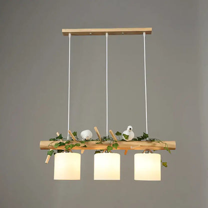 Rustic wood island light with maple leaf plant birds dining room