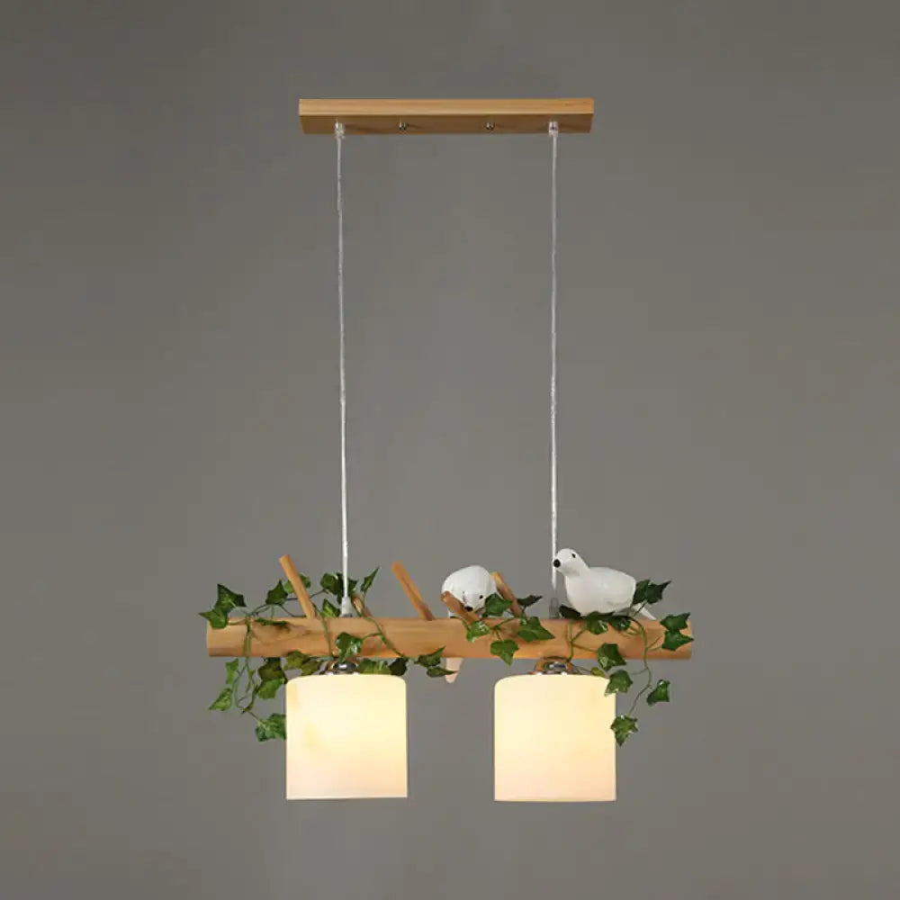 Rustic wood island light with maple leaf plant birds dining room