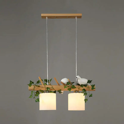 Rustic wood island light with maple leaf plant birds dining room