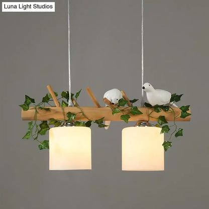 Rustic wood island light with maple leaf plant birds dining room