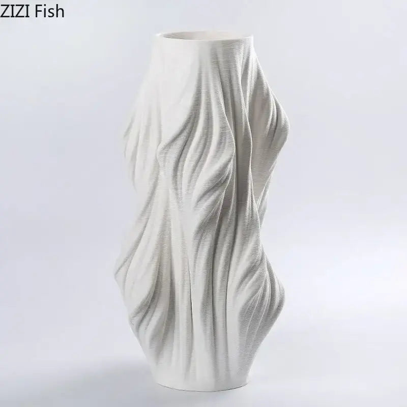 Sculpted white ceramic vase set with purple flowers for bedroom decor