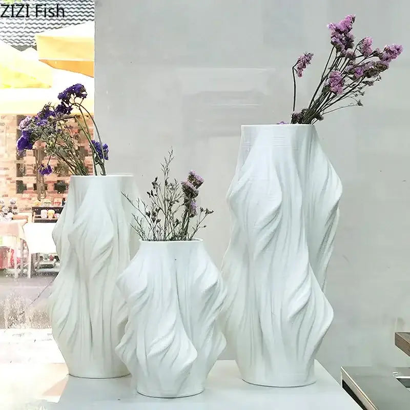 Sculpted white ceramic vase set with purple flowers for bedroom decor