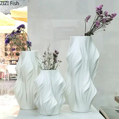 Sculpted white ceramic vase set with purple flowers for bedroom decor