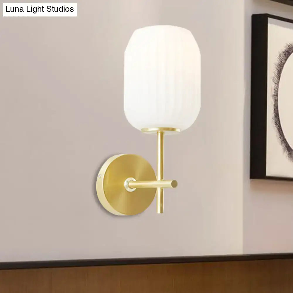 Simple gold light fixture with cream glass shade bedroom wall sconce