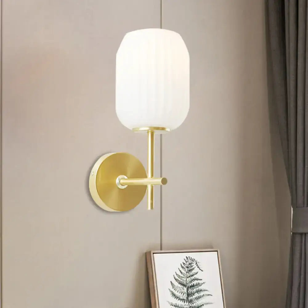 Simple gold light fixture with cream glass shade bedroom wall sconce