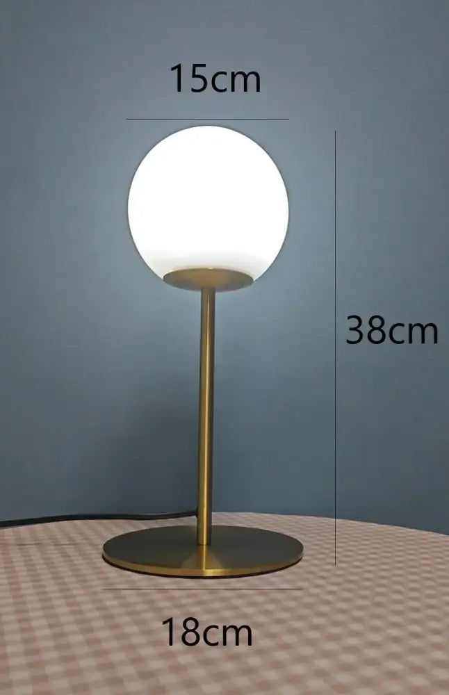 Sleek brass glass ball table lamp for bedroom with frosted shade