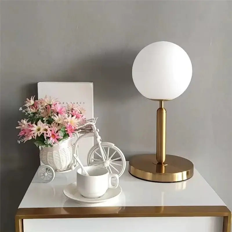 Sleek brass glass ball table lamp for bedroom with frosted shade