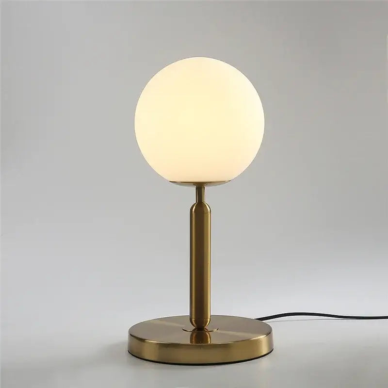 Sleek brass glass ball table lamp for bedroom with frosted shade