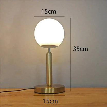 Sleek brass glass ball table lamp for bedroom with frosted shade
