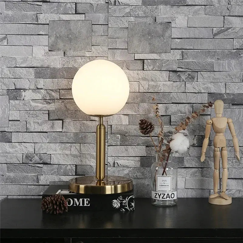 Sleek brass glass ball table lamp for bedroom with frosted shade