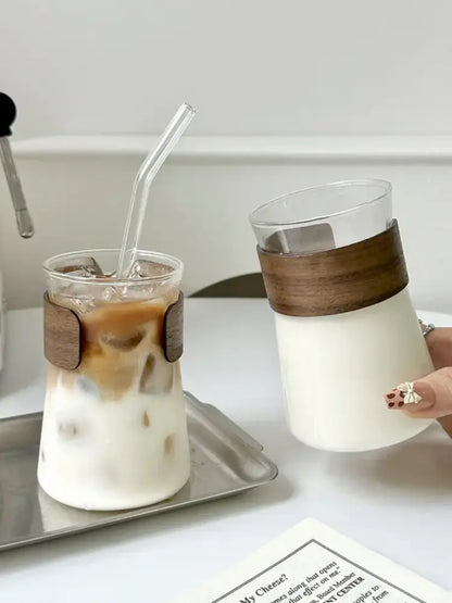 Sleek glass iced latte coffee cup with wood band kitchen tumbler