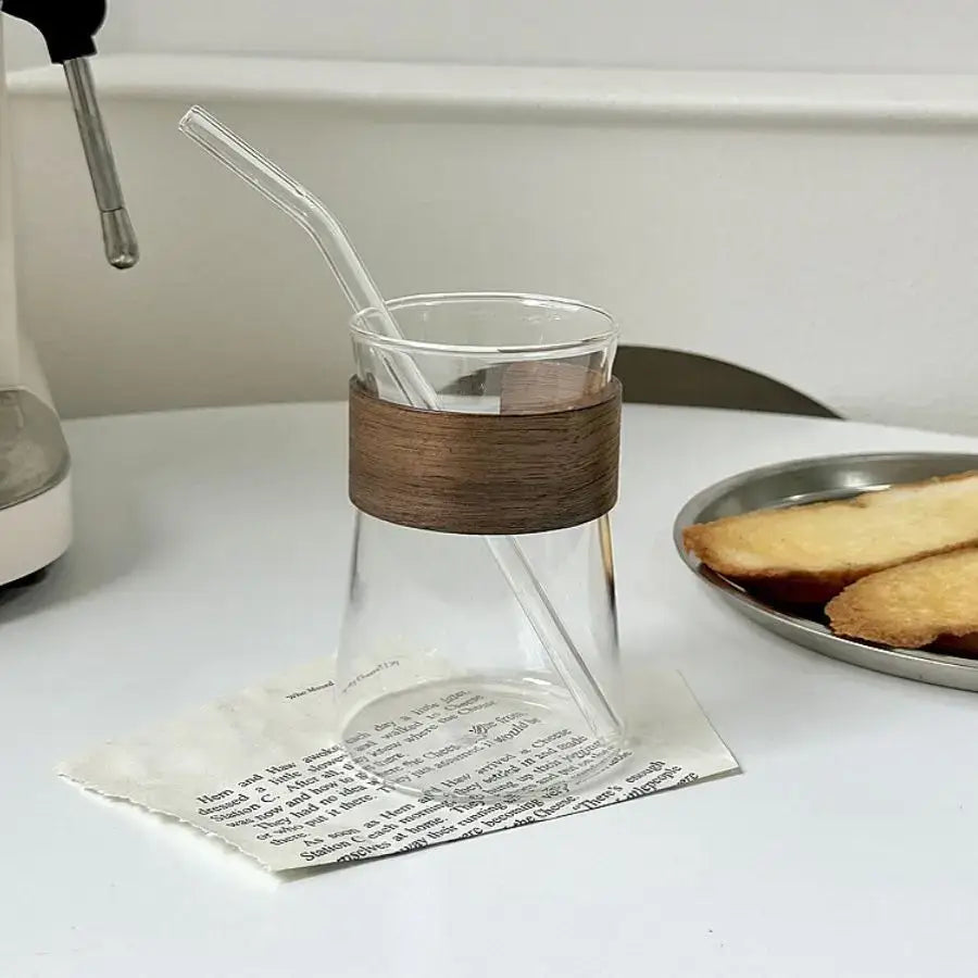 Sleek glass iced latte coffee cup with wood band kitchen tumbler