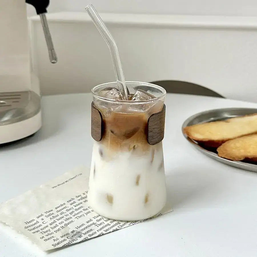Sleek glass iced latte coffee cup with wood band kitchen tumbler