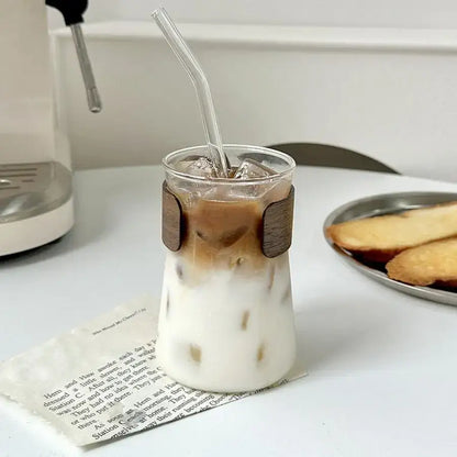 Sleek glass iced latte coffee cup with wood band kitchen tumbler