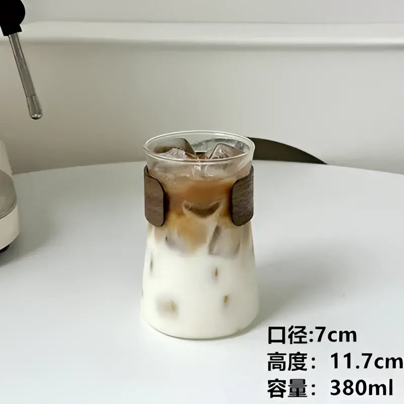 Sleek glass iced latte coffee cup with wood band kitchen tumbler