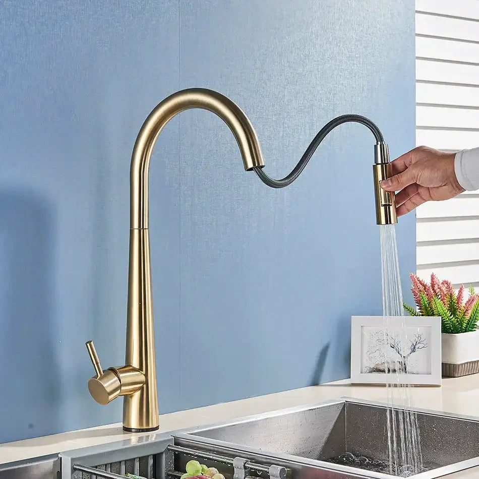 Sleek gold swivel kitchen faucet with pull down sprayer