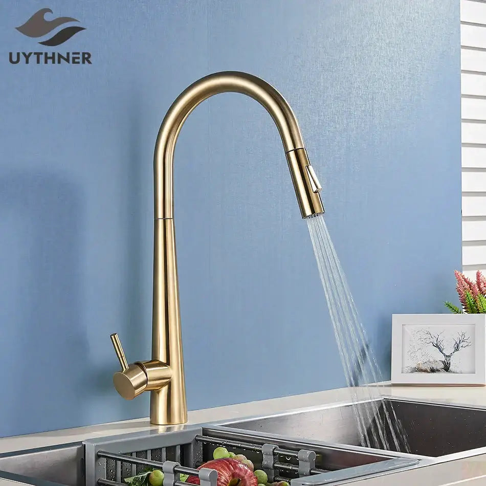 Sleek gold swivel kitchen faucet with pull down sprayer