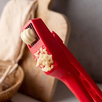 Sleek red manual press garlic crusher kitchen grinder