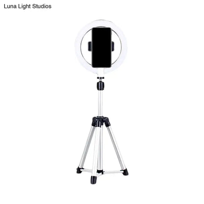 Sleek silver and white circular fill-in lamp bedroom phone holder