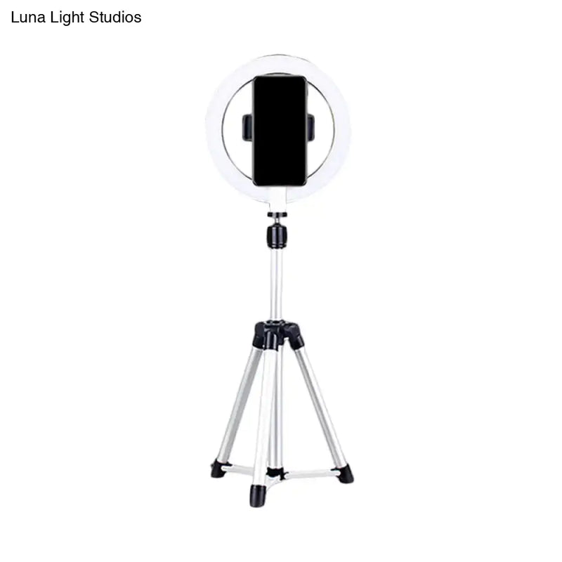 Sleek silver and white circular fill-in lamp bedroom phone holder
