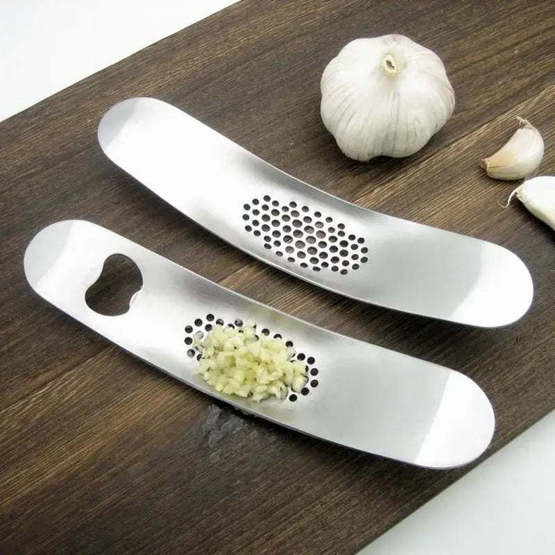 Sleek stainless steel garlic press with integrated spoon kitchen tool