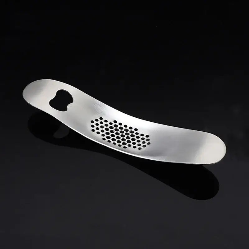 Sleek stainless steel garlic press with integrated spoon kitchen tool