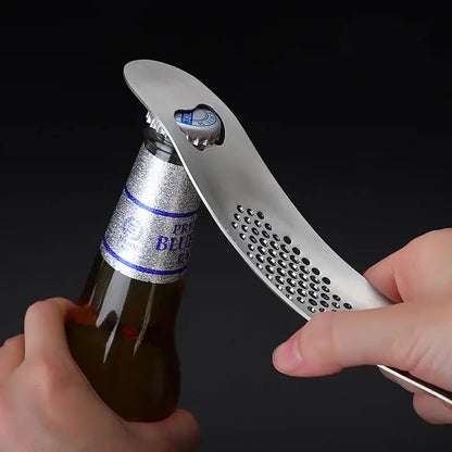 Sleek stainless steel garlic press with integrated spoon kitchen tool