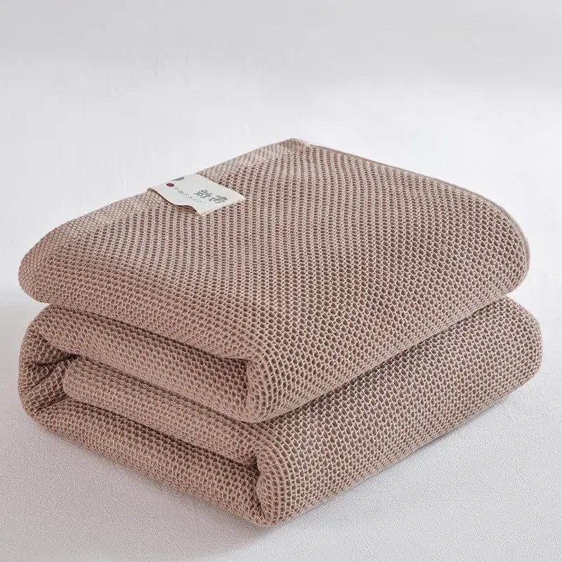 Soft beige cotton honeycomb towel blanket for living room couch