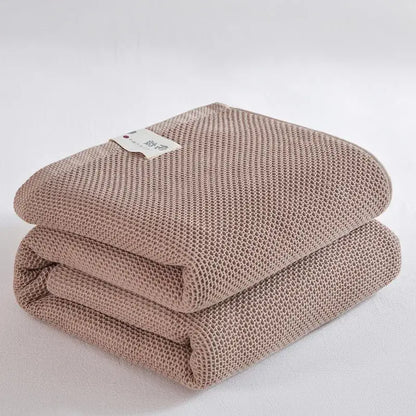 Soft beige cotton honeycomb towel blanket for living room couch