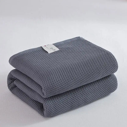 Soft beige cotton honeycomb towel blanket for living room couch