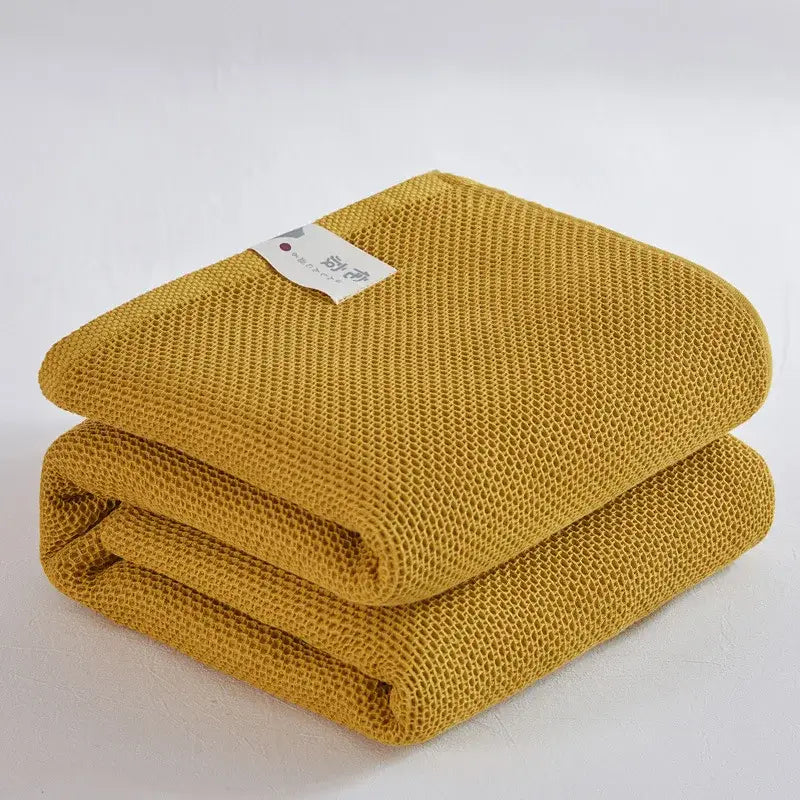 Soft beige cotton honeycomb towel blanket for living room couch