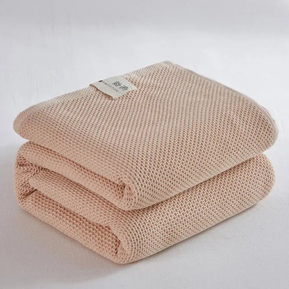 Soft beige cotton honeycomb towel blanket for living room couch