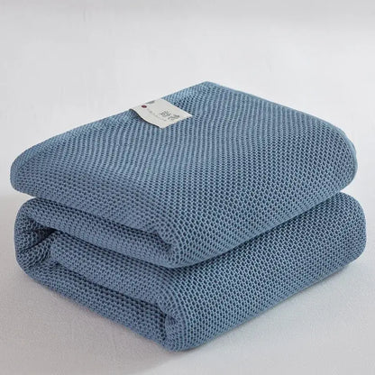 Soft beige cotton honeycomb towel blanket for living room couch