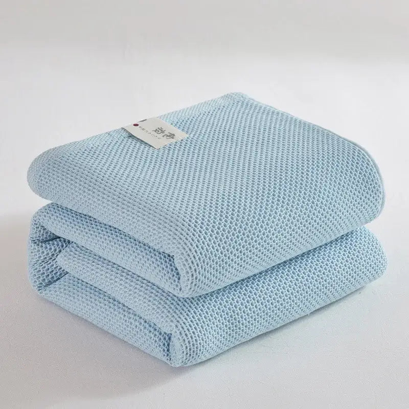 Soft beige cotton honeycomb towel blanket for living room couch