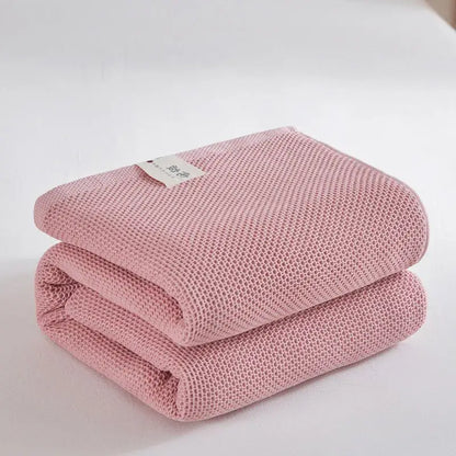Soft beige cotton honeycomb towel blanket for living room couch