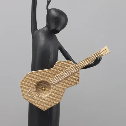 Stylized black and gold guitarist resin figure – living room decor