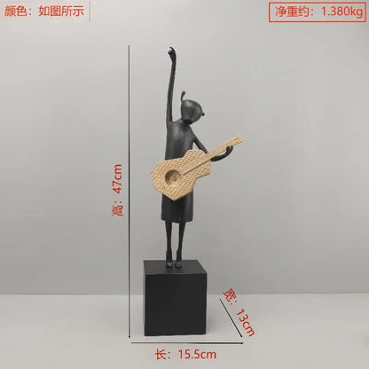 Stylized black and gold guitarist resin figure – living room decor