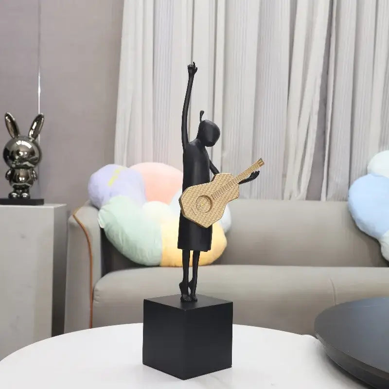 Stylized black and gold guitarist resin figure – living room decor