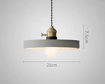 Teal blue glass pendant light with brass hardware for dining room