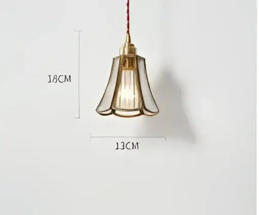 Teal blue glass pendant light with brass hardware for dining room