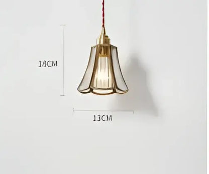 Teal blue glass pendant light with brass hardware for dining room