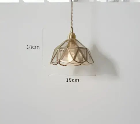 Teal blue glass pendant light with brass hardware for dining room