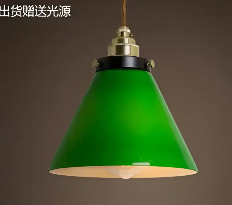 Teal blue glass pendant light with brass hardware for dining room