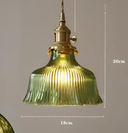 Teal blue glass pendant light with brass hardware for dining room