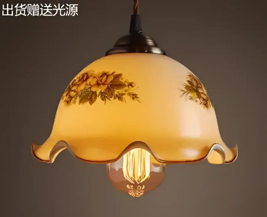 Teal blue glass pendant light with brass hardware for dining room